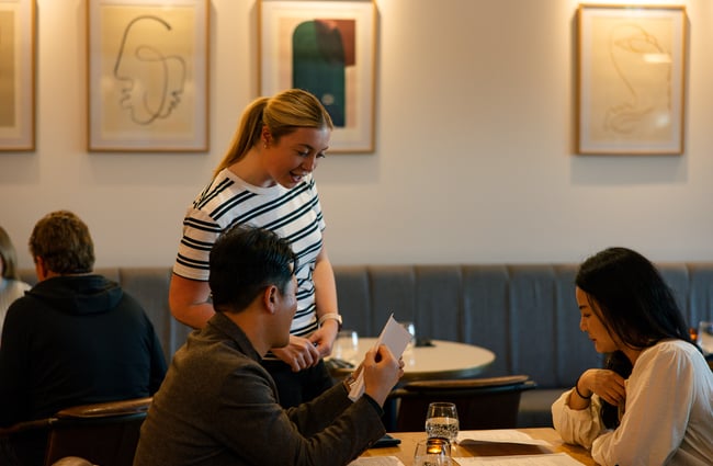 Waitress taking order from couple at Earl in Christchurch