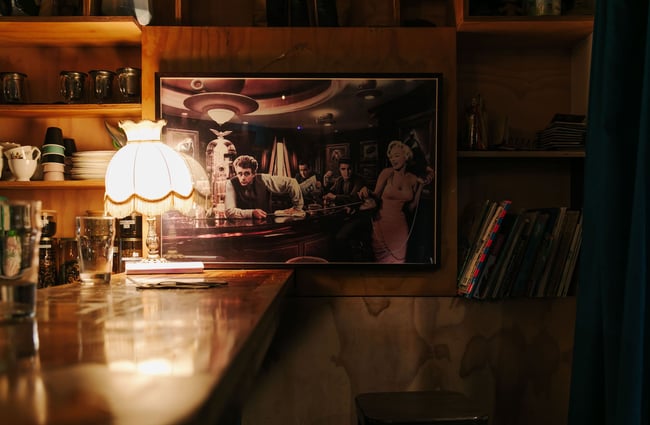 Retro lampshade on the bar with James Dean photo on the wall.