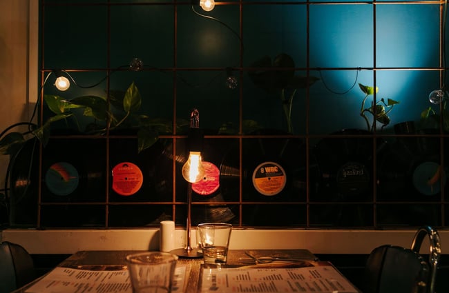 Table for two at East St Cafe with records on the wall.