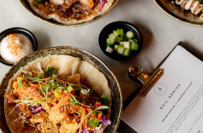 A close up of bowl of food at the Evil Genius bar.