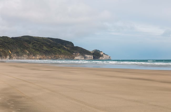 A sandy beach on a sunny day.