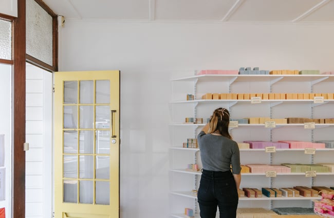 Customer looking at soaps at Global Soap, Nelson.