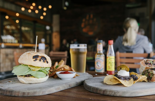 Burger and burrito on table at Golden Bear Brewing Company, Māpua Tasman.