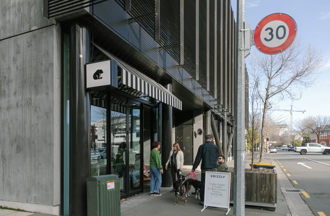 People standing outside a cafe on a Christchurch street.