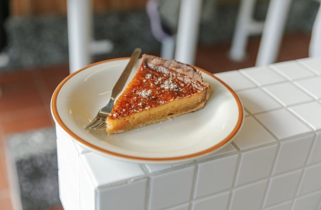 A slice of pie on a plate.