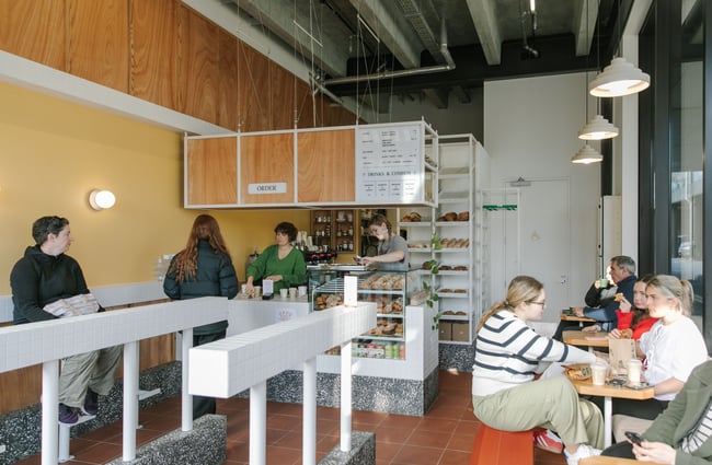 A busy cafe on a sunny day.