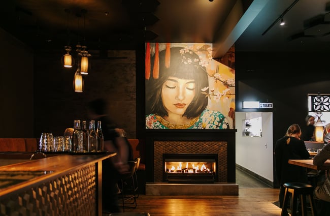 Artwork of a woman's face on the wall at Harry's Hawker House.