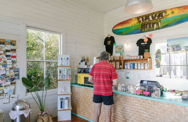 Customer ordering at the till at Java Hut, Māpua.