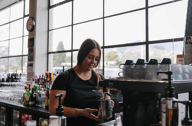 Barista making a coffee at McCashins Brewery.