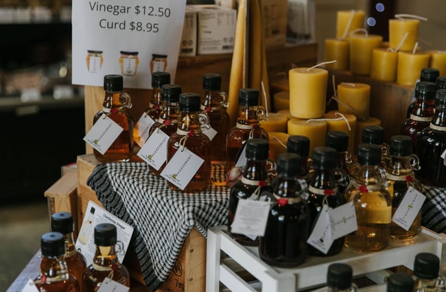 Bottles of vinegar and candles on display at Old Factory Corner, Nelson Tasman.