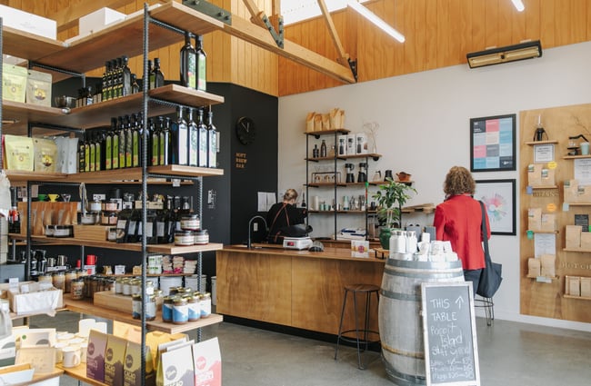 The inside of Rabbit Island with coffee beans and coffee making equipment on display.