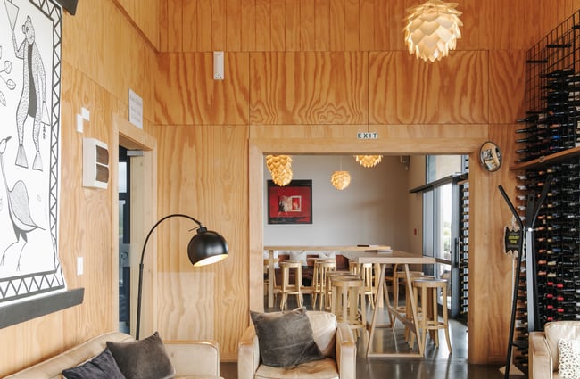 The inside dining space of Rimu with a mix of low and high tables and chairs.