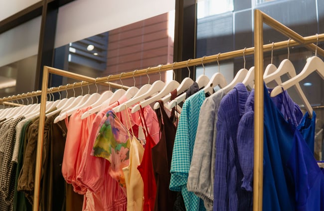 Close up of colourful clothing on hangers inside Ruby clothing store in Central Christchurch.