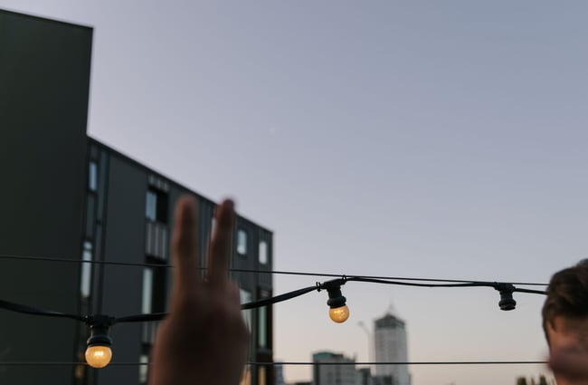 Peace sign and outdoor lights.