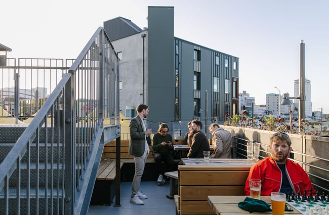 People drinking on the deck area.