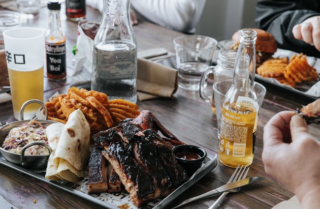 Close up of BBQ food on a table.