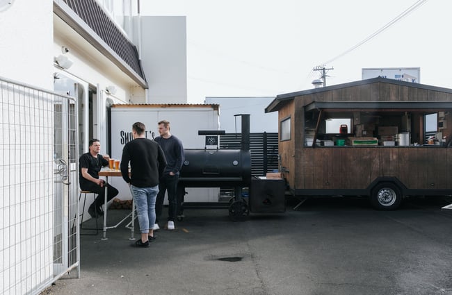 A caravan outside the Smokey T's building.