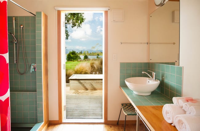 The blue and white bathroom inside an Apple Picker's Cottage.