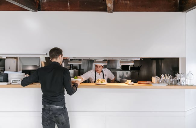 Chef at the pass at Boat Shed Cafe.