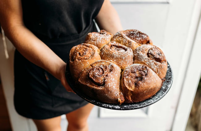 A close up of sweet scrolls on a table.