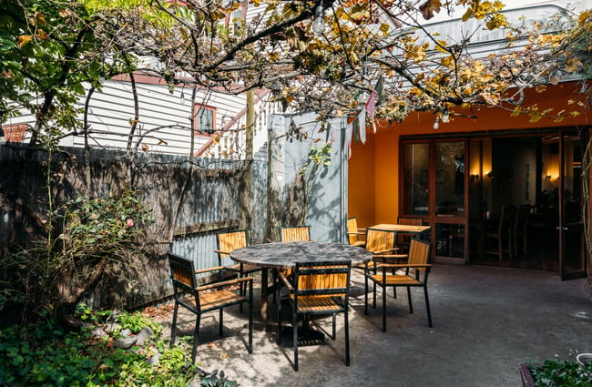 A table and chairs outside the Dangerous Kitchen.