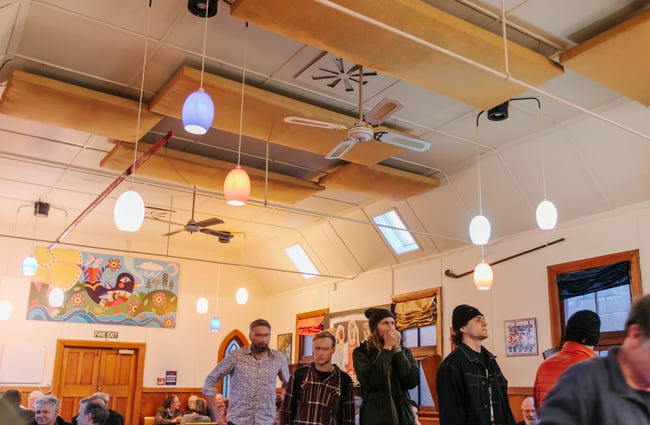 Men queuing to order drinks at The Free House.