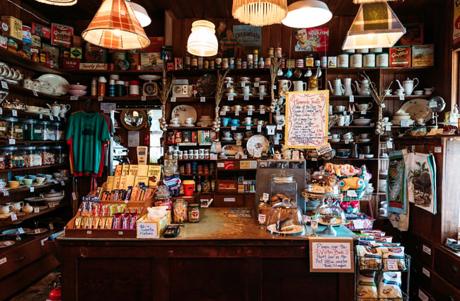 The counter surrounded by lollies and scones.