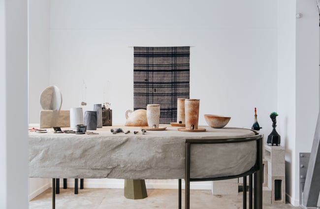 Concrete table covered in ceramics.