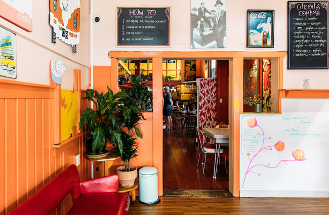 An entranceway through to another room in a cafe.