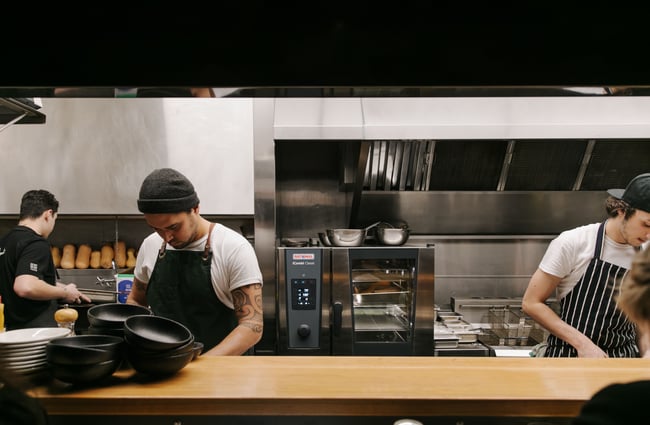 Chefs in the kitchen at Urban Oyster Bar and Eatery.