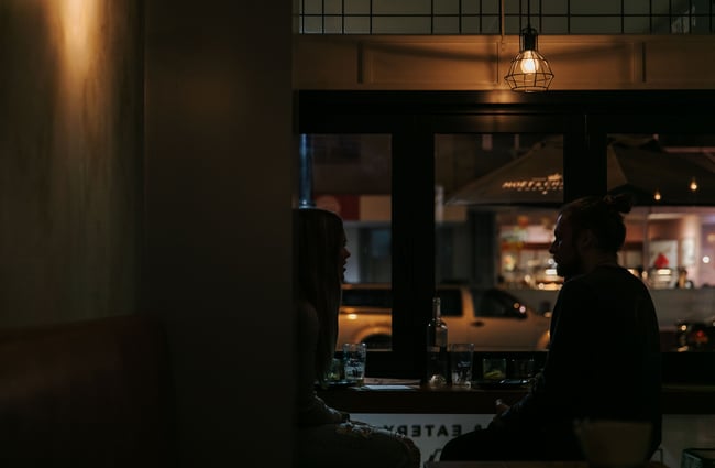 Couple dining in the window at Urban Oyster Bar & Eatery.