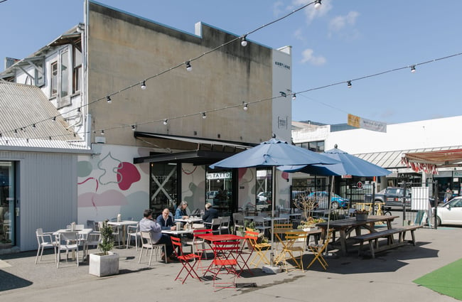 The exterior courtyard of the Victus Coffee & Eatery.