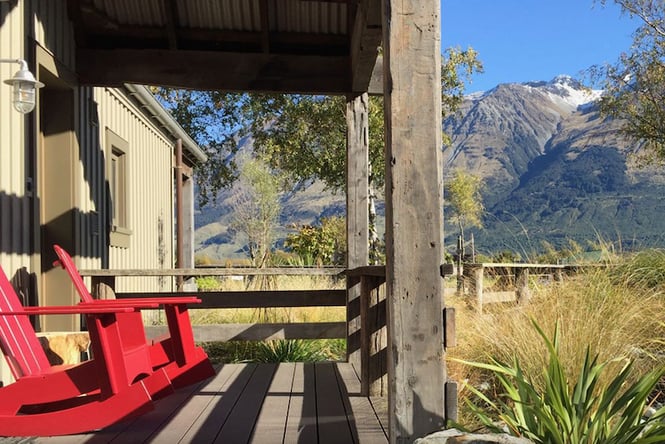 Red seats looking out to the mountains at Camp Glenorchy.