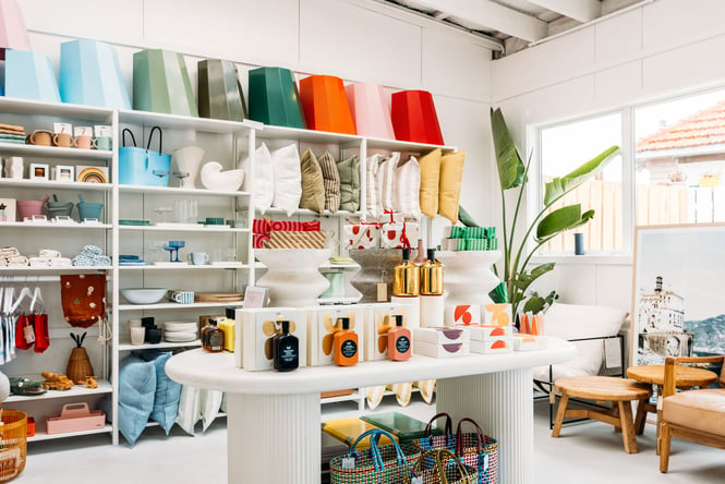 Brightly coloured homewares on display inside a lifestyle store.