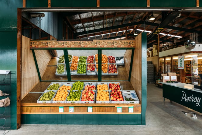Fruit and vegetable on display inside a grocer.