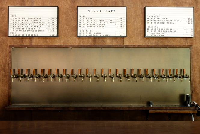 Close up of drinks menu and taps at Norma Taps in Auckland