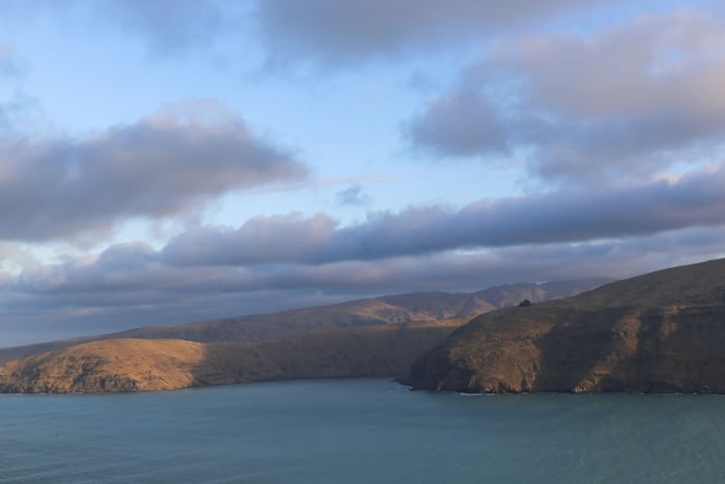 Looking across the blue water to the Godley Heads hills in Christchurch.