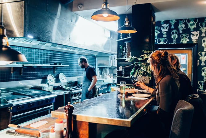 Couple dining at the Chef's Table at 5th Street.