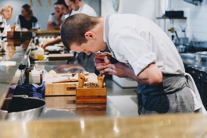 Chef working at the bar at Inati.