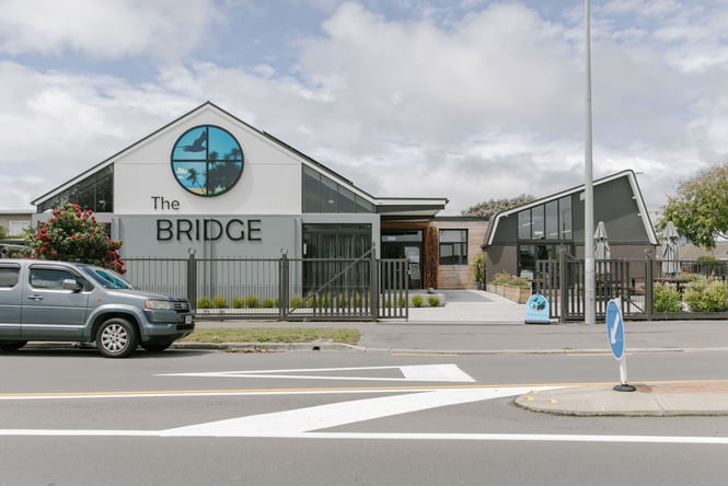 The exterior of The Bridge New Brighton on a grey day.