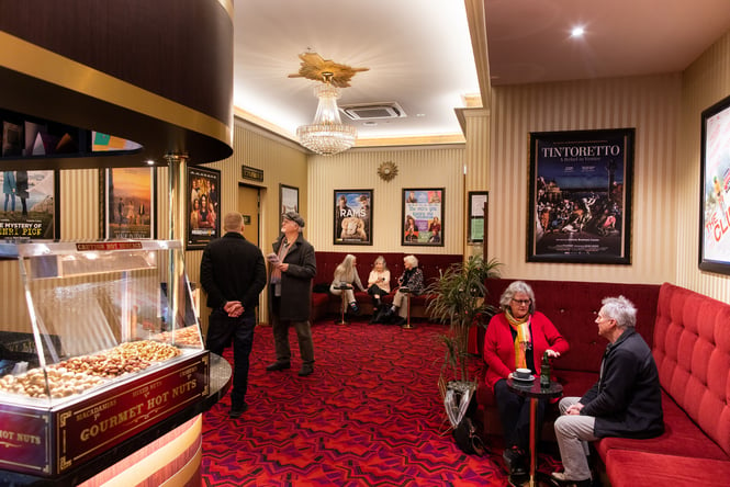 Cinemagoers waiting in the foyer.