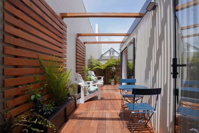 The wooden porch outside Oak Tree House accommodation in Nelson.