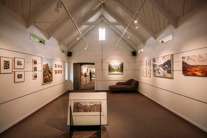 The darkly lit interior of Estuary Art Gallery in Golden Bay.