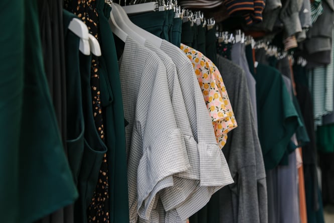 A close up of clothing on a rack.