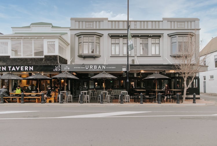 A photo of the front entrance to two iconic Nelson bars, taken from across the street.