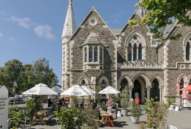 Exterior shot of the historic Arts Centre and Frances Nation Cafe in Christchurch on a hot summer's day