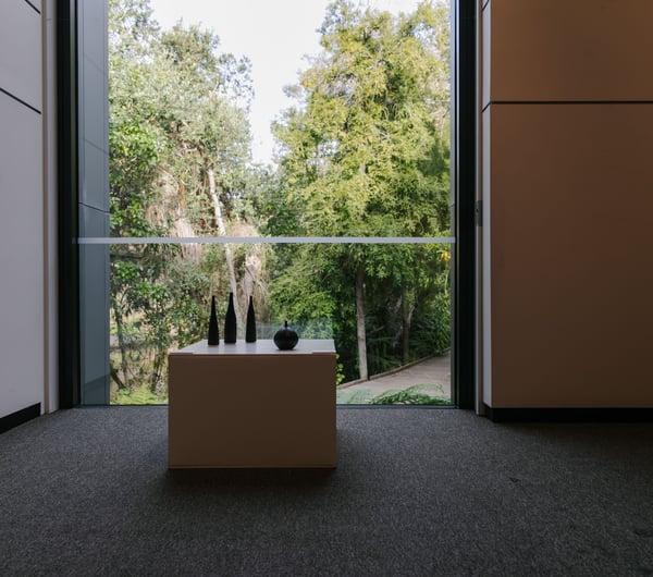 Sculptures by a window at The Suter Art Gallery.