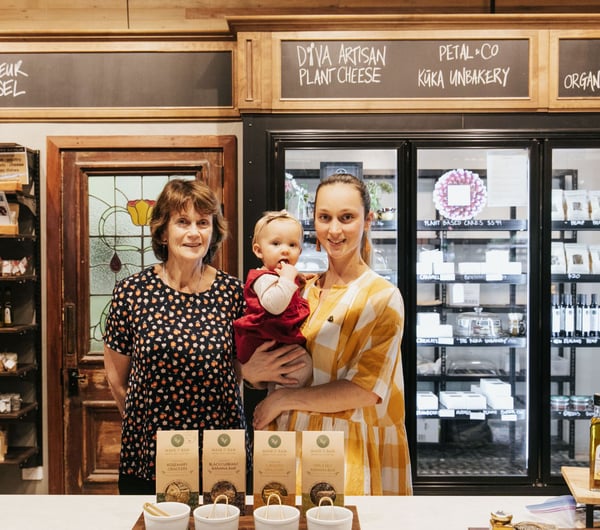 A photo of Julia with her mother and child.