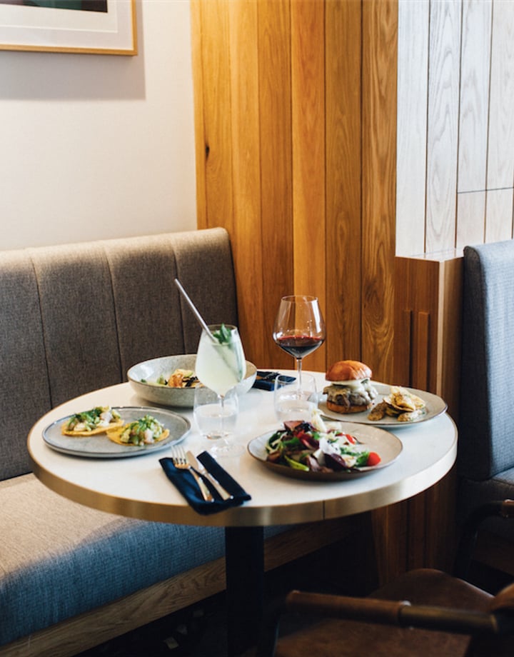 Sharing plates on a table at Earl, Christchurch