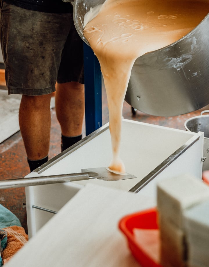 Liquid soap being poured on to a table ready for setting.